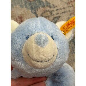 Steiff Blue Teddy Bear 236600 Flower Paw Lying Down Baby Soft plush toy